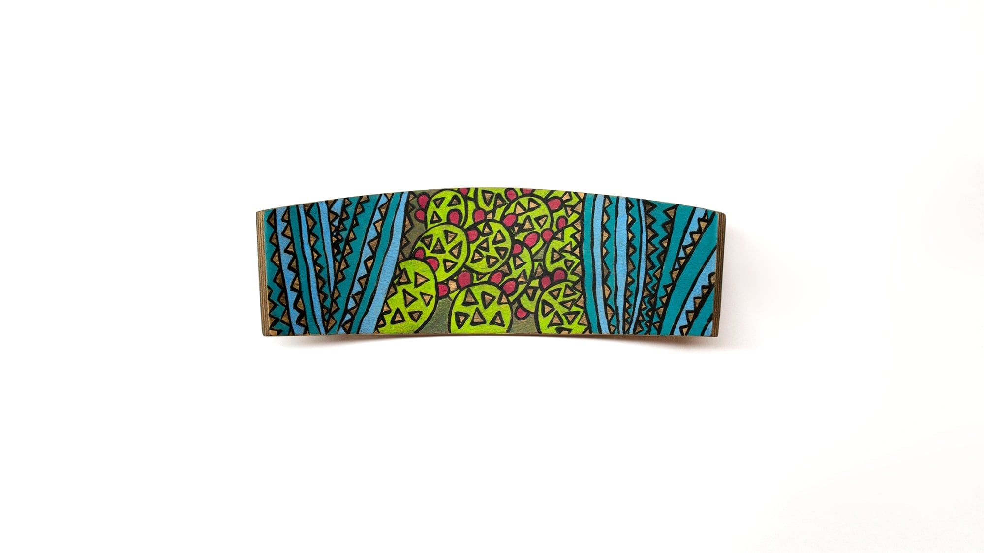 A wide, curved wooden surface painted with intricate green and blue floral patterns against a dark background.
