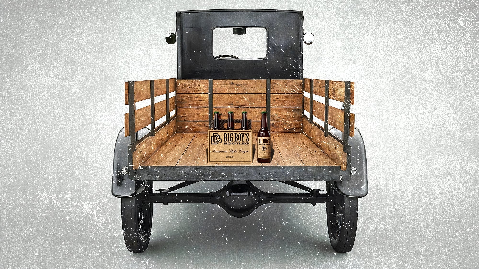 'Old truck bed made of wood, black metal frame, 'Big Boy's Bootleg' and 'American Style Lager' beer bottles.'