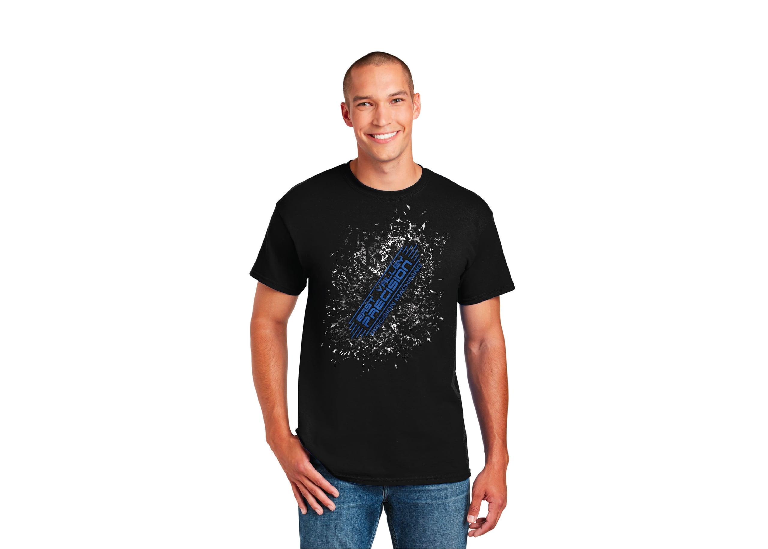 The image showcases a man standing against a white background. He's wearing a black t-shirt with a blue logo and text. His pose is relaxed, with his left hand in his pocket. On his right arm, he sports a tattoo of a planet. He's smiling and appears to be the subject of the image. Behind him, there's a blurred background that suggests an outdoor setting. The overall composition is casual yet eye-catching, effectively using contrast and color to highlight the man and his t-shirt design.